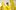 Artist Sagarika Sundaram, wearing a yellow shirt, stood in the middle of a large, yellow textile sculpture.